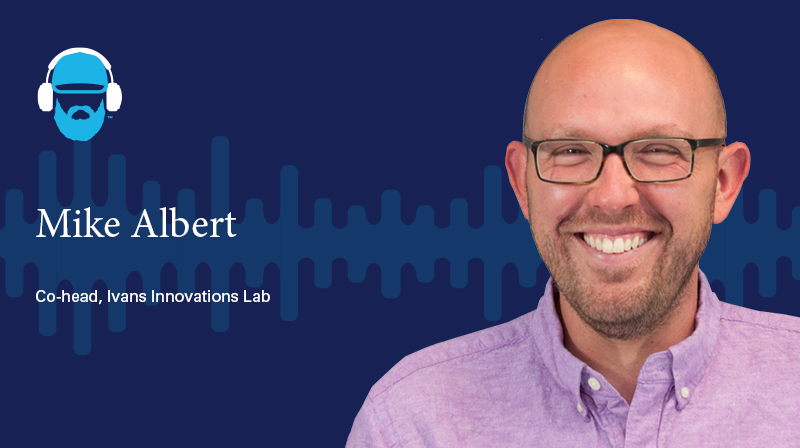 A photo of Mike Albert Co-head, Ivans Innovations Lab on a dark blue background with a soundwave design 