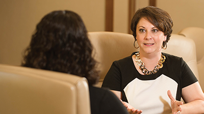 Two women in business attire having a meeting